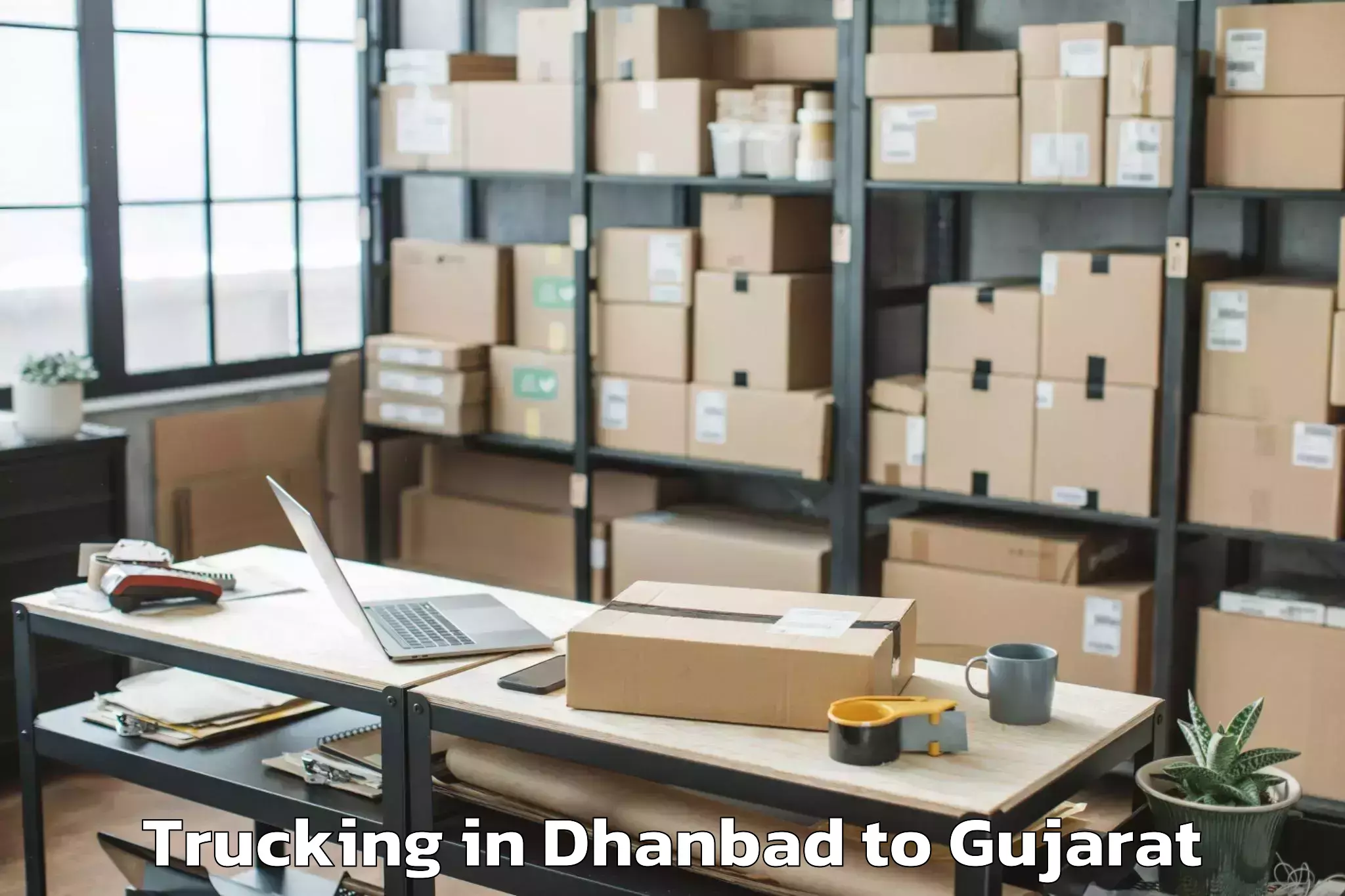 Quality Dhanbad to Abhilashi University Surat Trucking